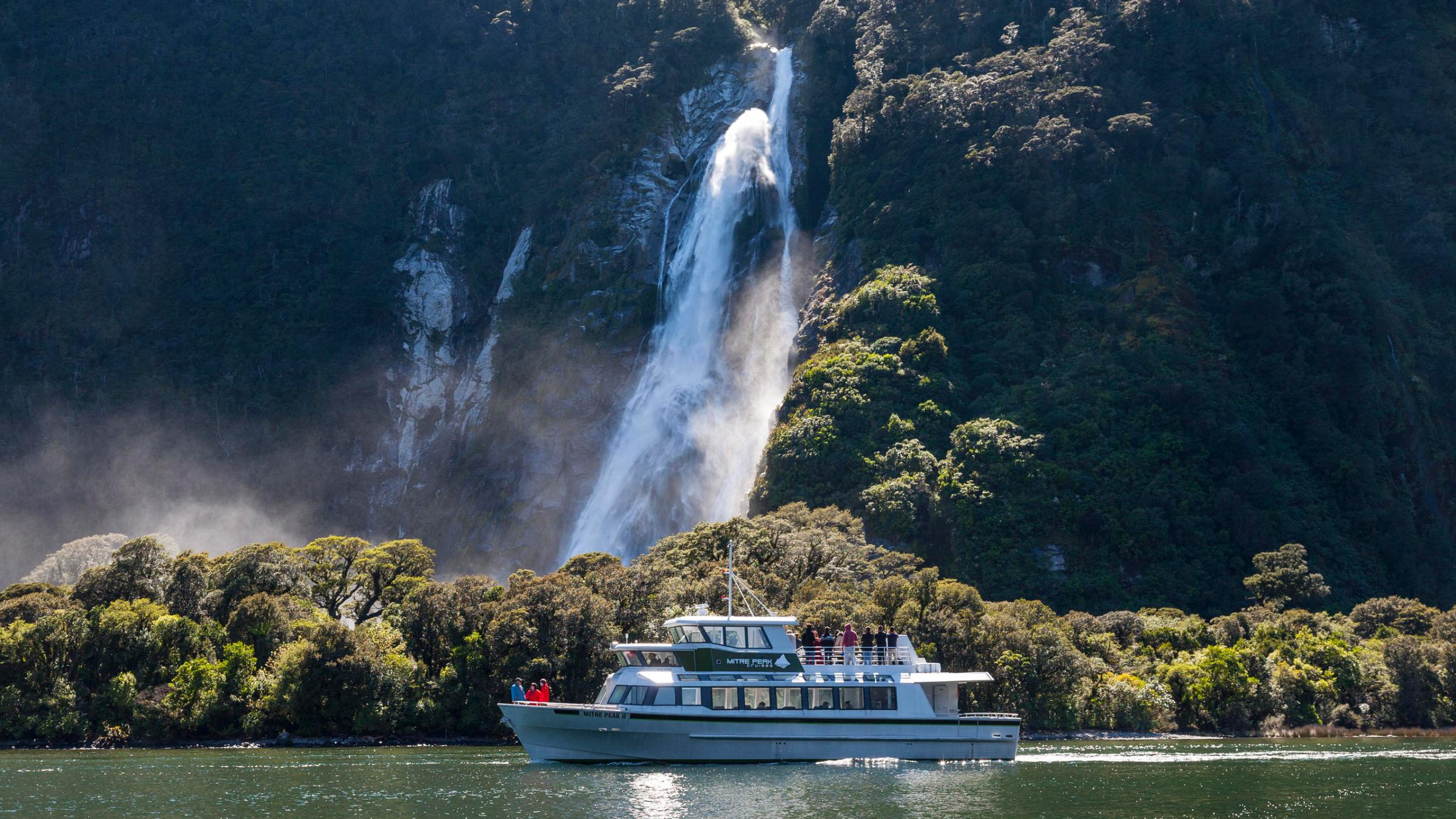 a large waterfall over a body of water